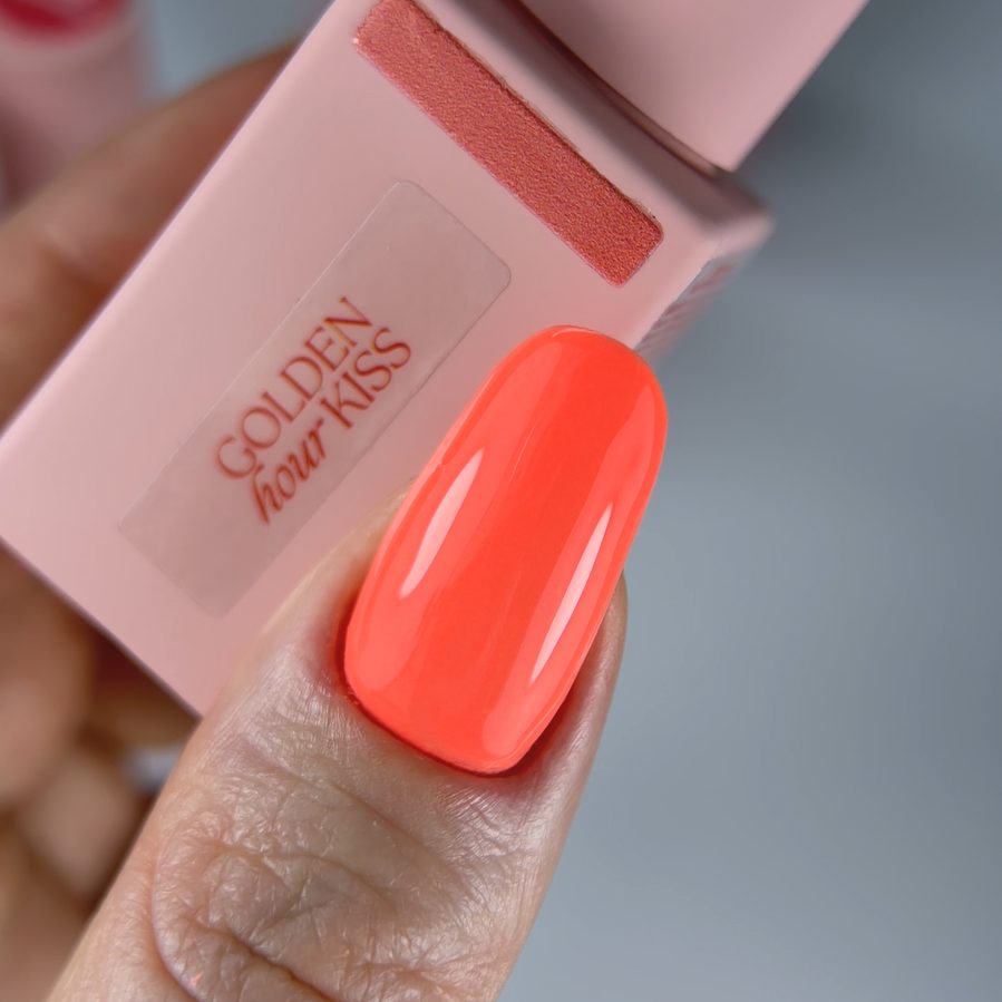 Coral gel polish swatch with branded bottle